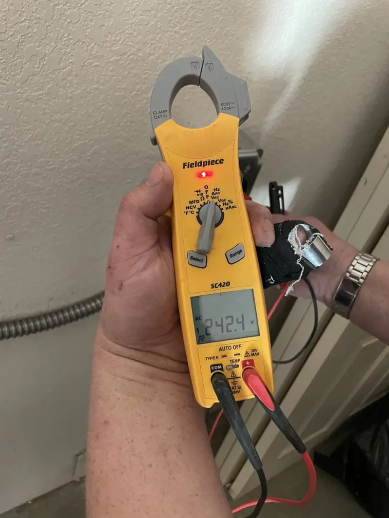 Voltage testing with clamp meter during Generator Installation in Plaistow
